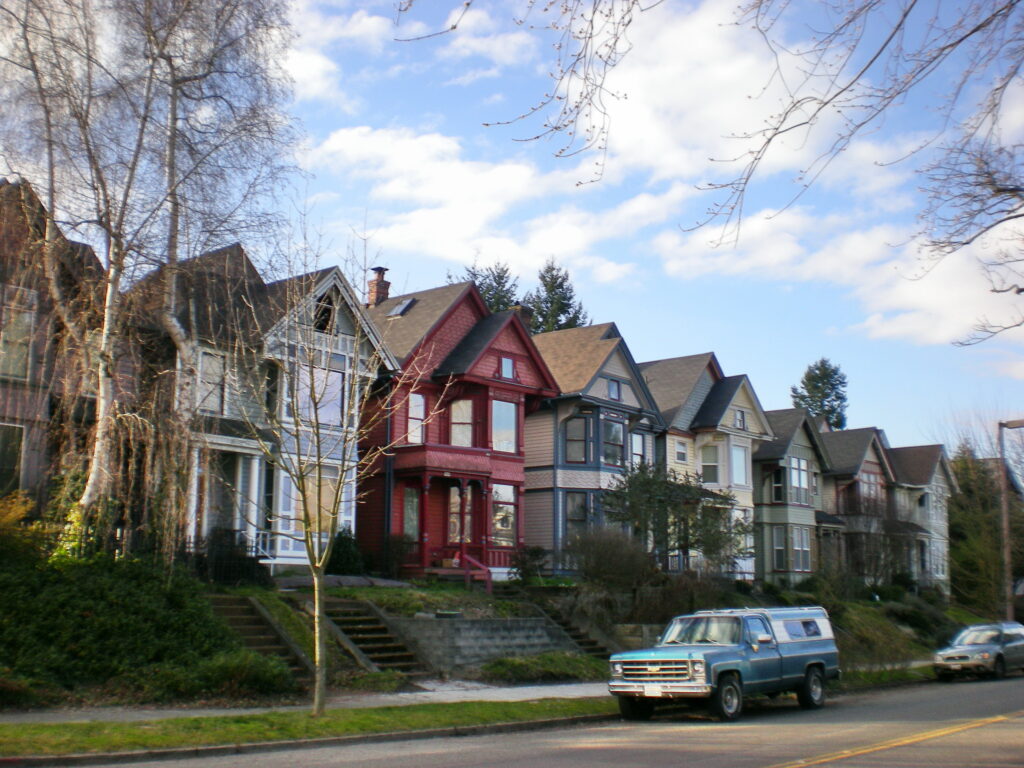 Row of older Victorian homes with street trees in Tacoma's South J Street Historic District